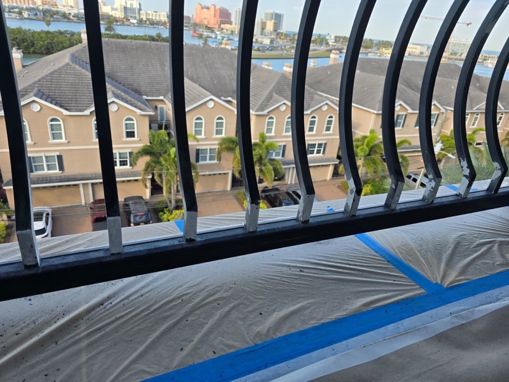 Ornamental balcony railing recoated in place