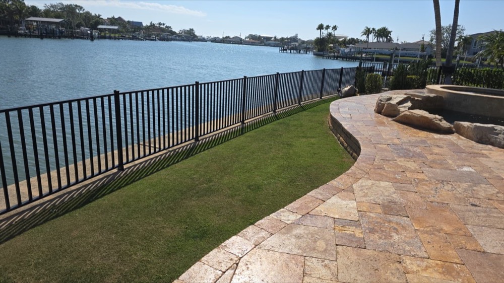 Powder-coated perimeter fencing along a waterfront