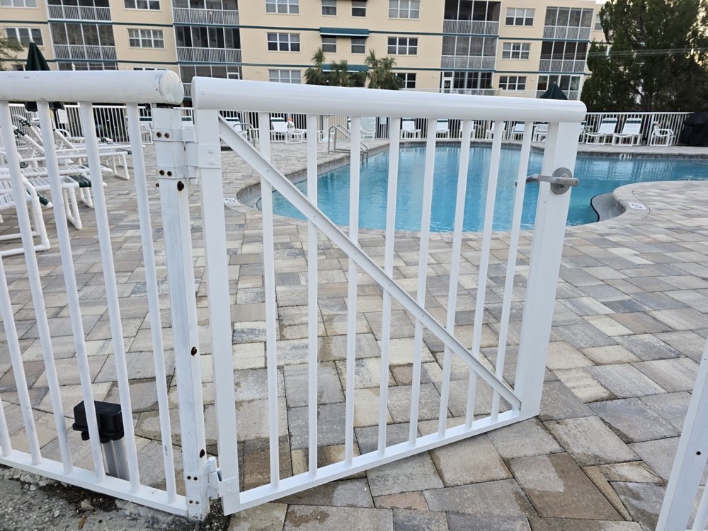 White pool enclosure fencing