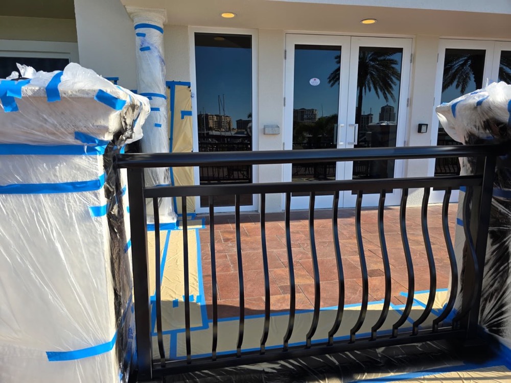 Ascend technician applying an electrostatic coating