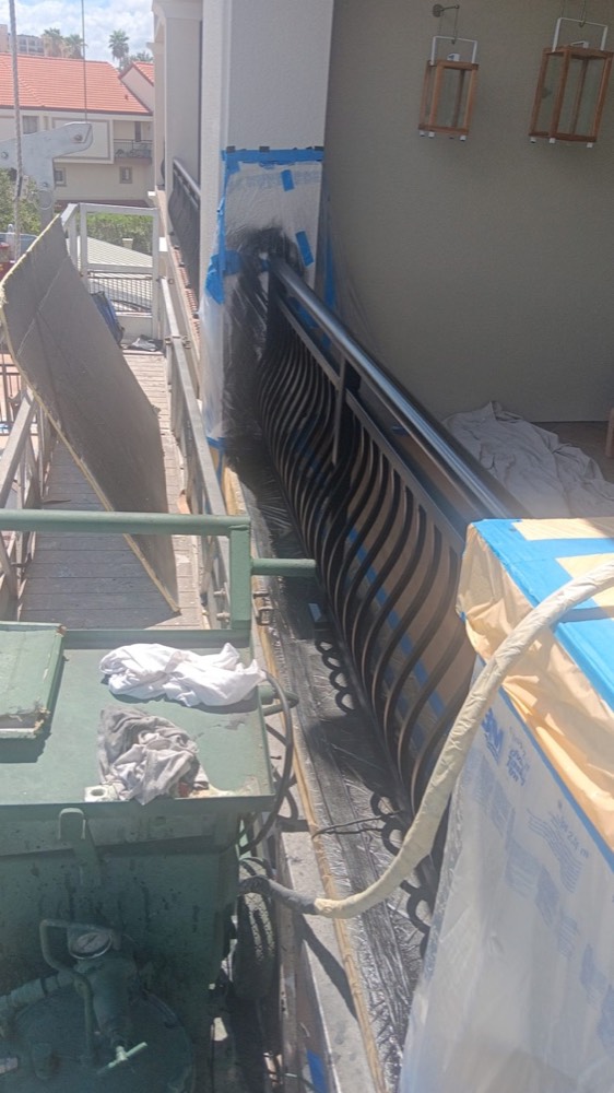 Ascend technician applying an electrostatic coating
