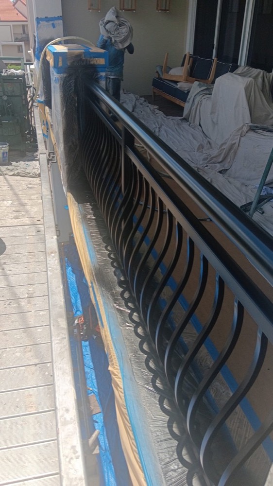 Ascend technician applying an electrostatic coating