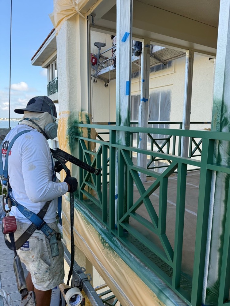 Ascend technician applying an electrostatic coating on site