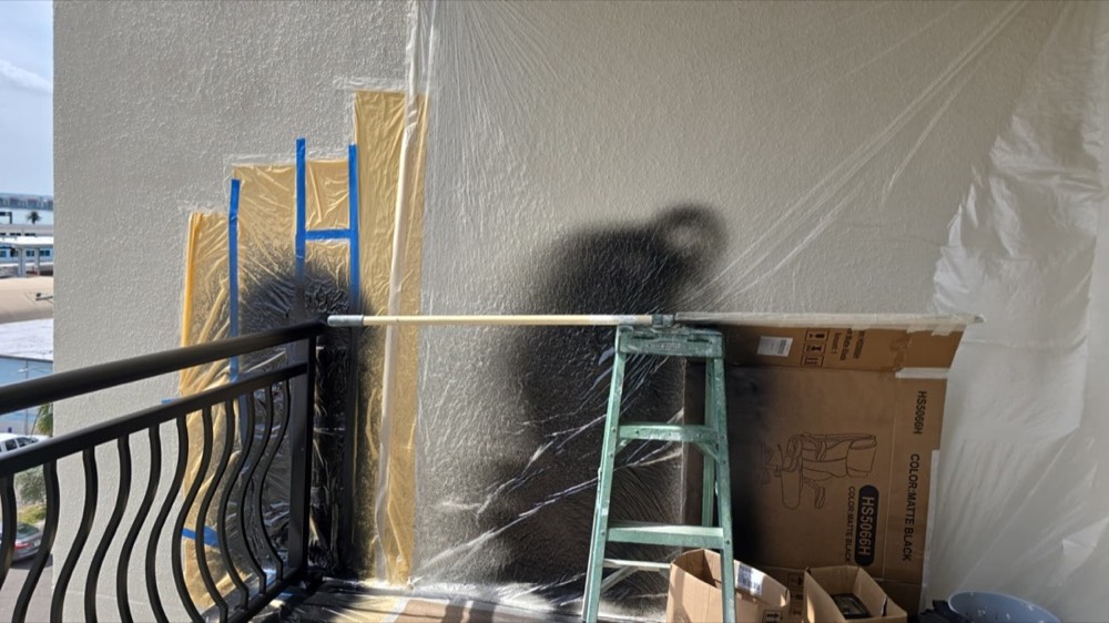 Ascend technician applying an electrostatic coating