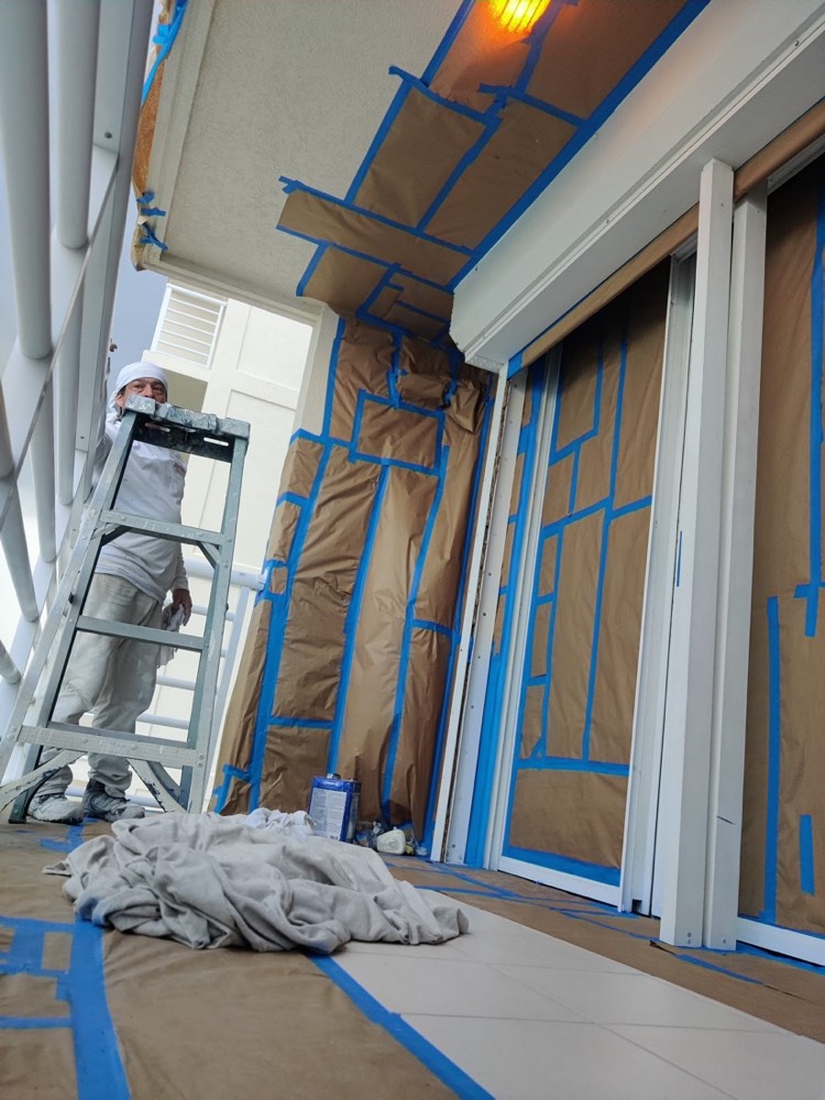 Ascend technician applying an electrostatic coating