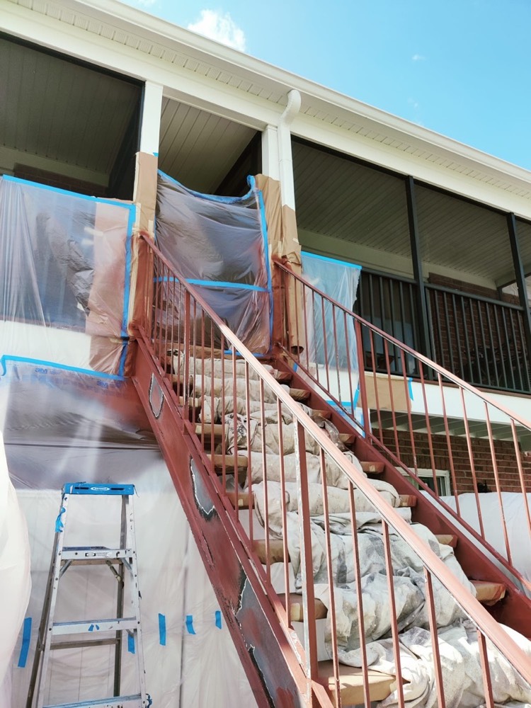 Ascend technician applying an electrostatic coating